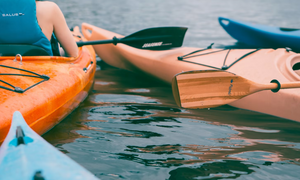 Sit in kayaks with paddles