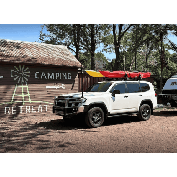 Aquanauta kayaks on roof racks side by side 