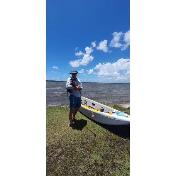 Man_with_dog_on_inflatable_air_canoe